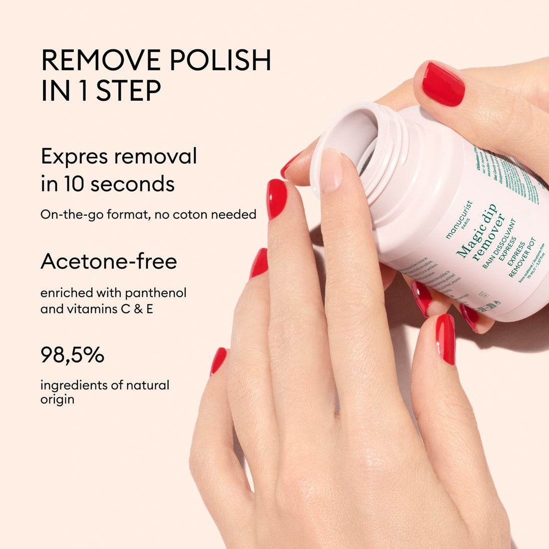 Wearing red nails, someone uses Manucurist Magic Dip Remover—a travel-friendly jar for quick, acetone-free removal in 10 seconds. It’s enriched with panthenol, vitamins C  E, and made with 98.5% natural ingredients.