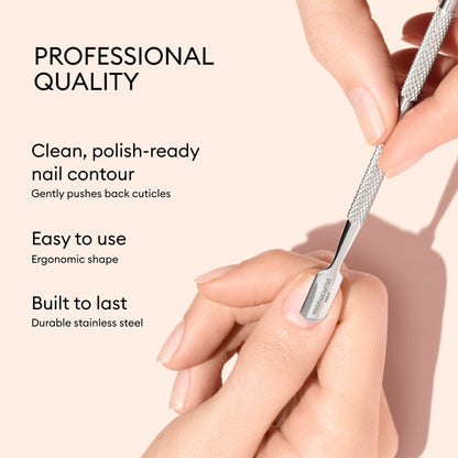 A hand uses the Manucurist Steel cuticle pusher on fingernails, making nail care effortless. Text describes features: professional quality, clean nail contour, ergonomic shape, and durable stainless steel.