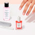 A hand with neatly manicured nails is shown beside the Manucurist Active™ Discovery Kit, featuring a bottle of remover, a bottle of nail polish, and two nail files—all arranged on a light surface—providing an ideal setup for maintaining your nail care routine and ensuring healthy, hydrated nails.