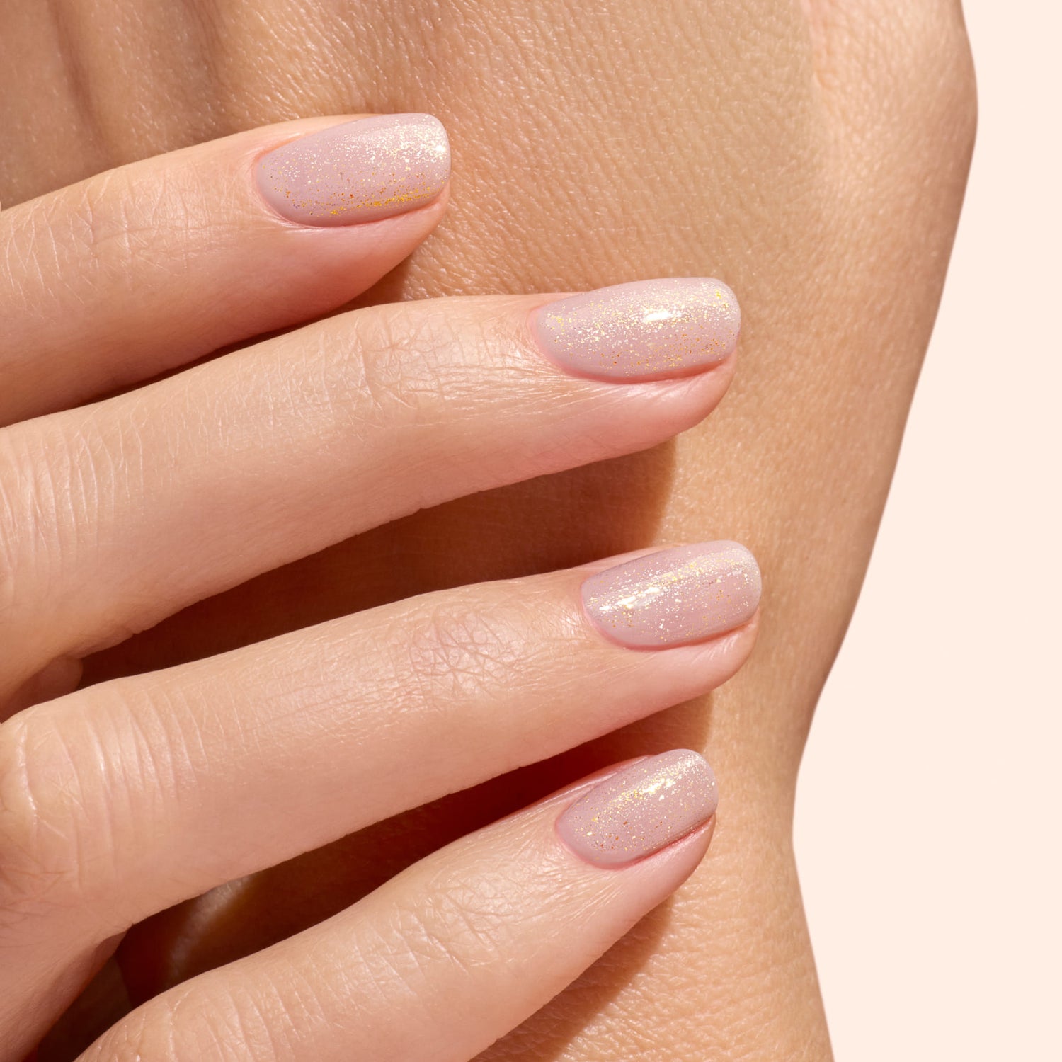 A close-up of a hand with neatly manicured nails featuring Manucurist&