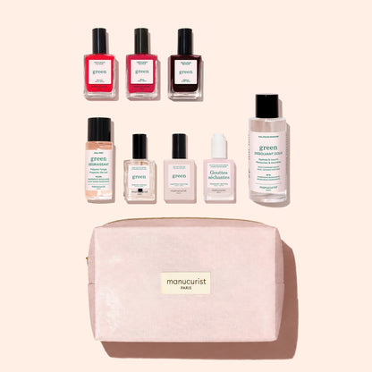 The Manucurist Starter Kit, featuring gel-effect nail polish, nail care bottles, and remover, is displayed above an organic cotton pouch labeled “manucurist PARIS” against a beige background.