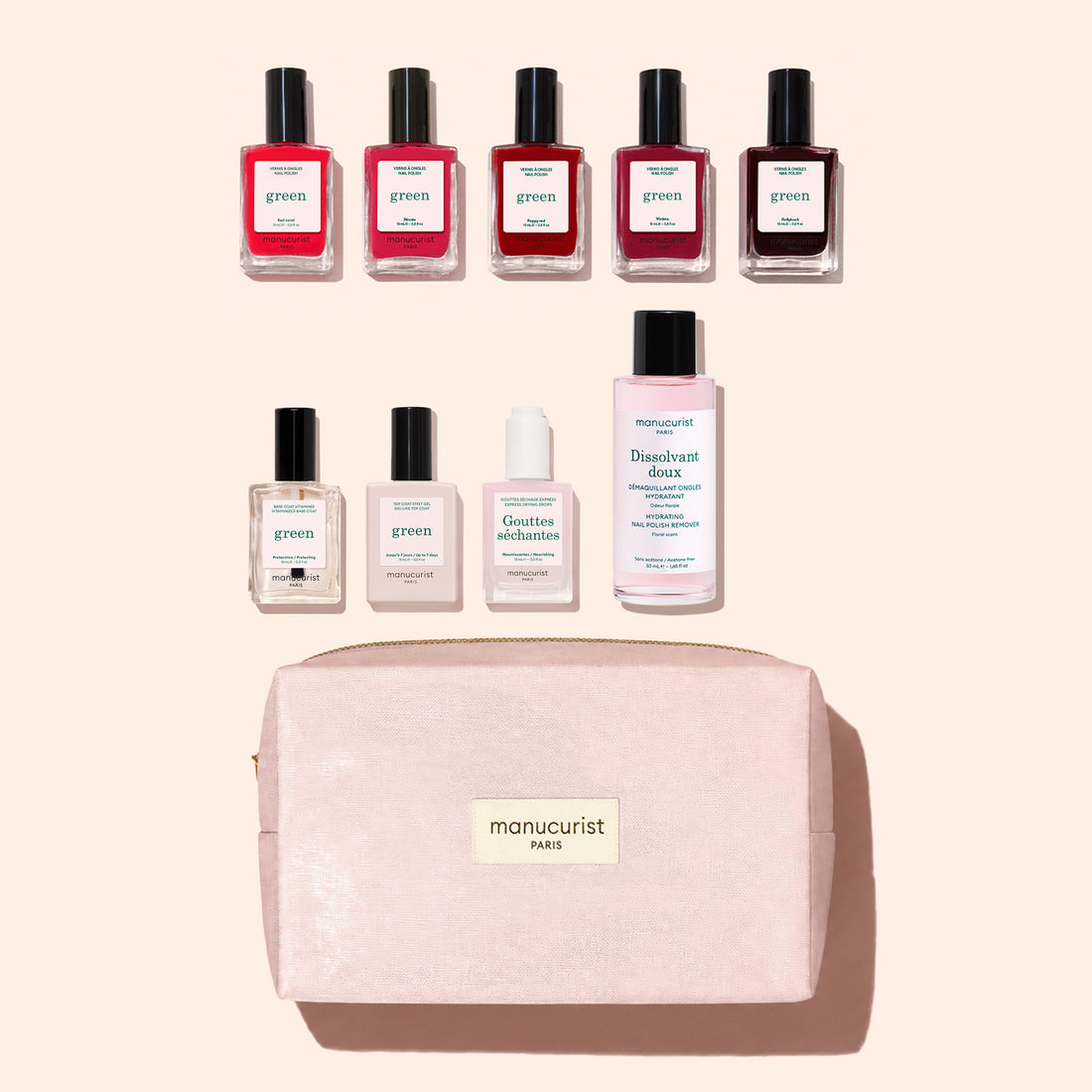 Nine bottles from the Manucurist Super Starter Kit and a light pink Manucurist Paris bag are arranged neatly on a beige background. The kit includes gel-effect nail polish, base coat, top coat, drops, and remover—offering everything you need for the perfect at-home Green manicure pampering session.