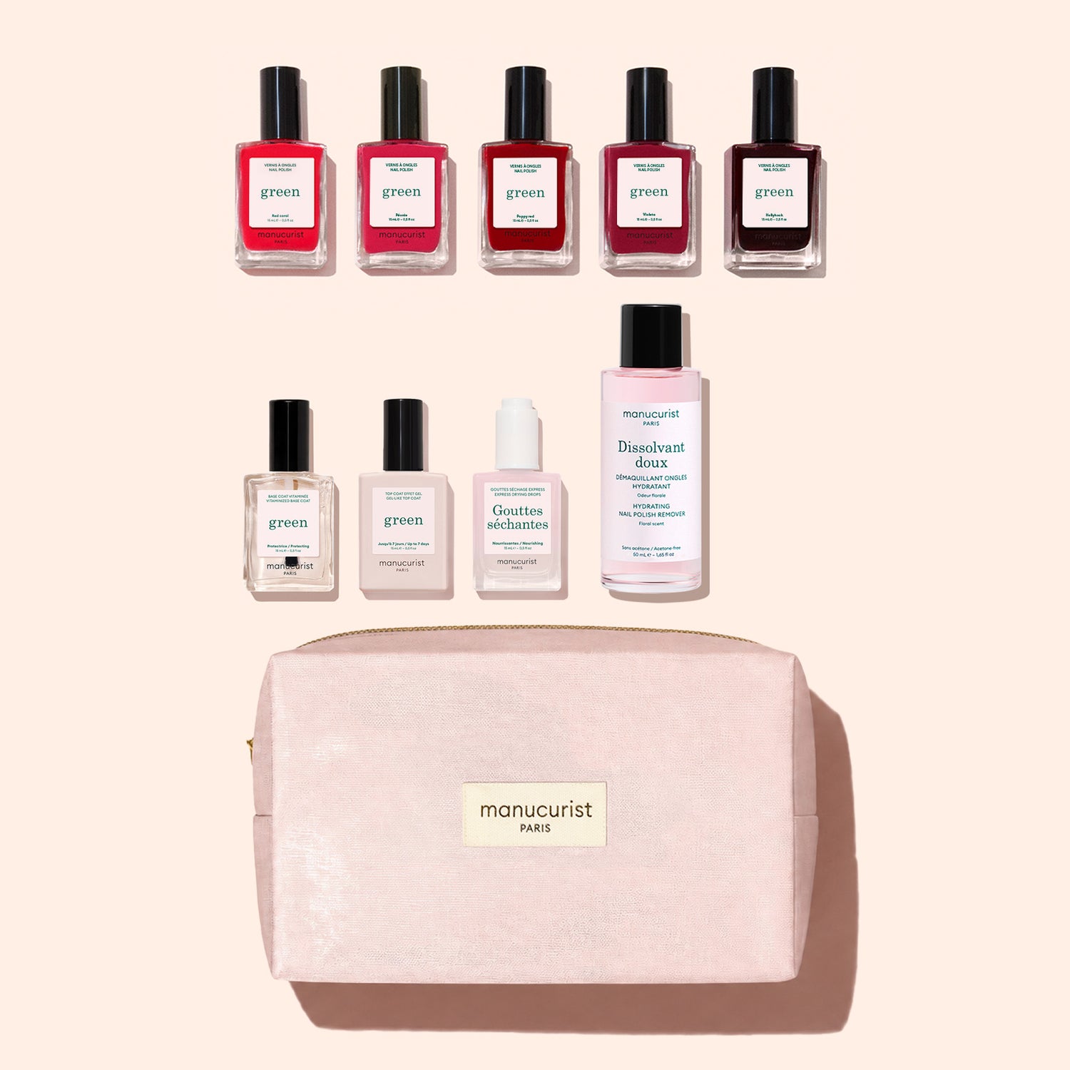Nine bottles from the Manucurist Super Starter Kit and a light pink Manucurist Paris bag are arranged neatly on a beige background. The kit includes gel-effect nail polish, base coat, top coat, drops, and remover—offering everything you need for the perfect at-home Green manicure pampering session.
