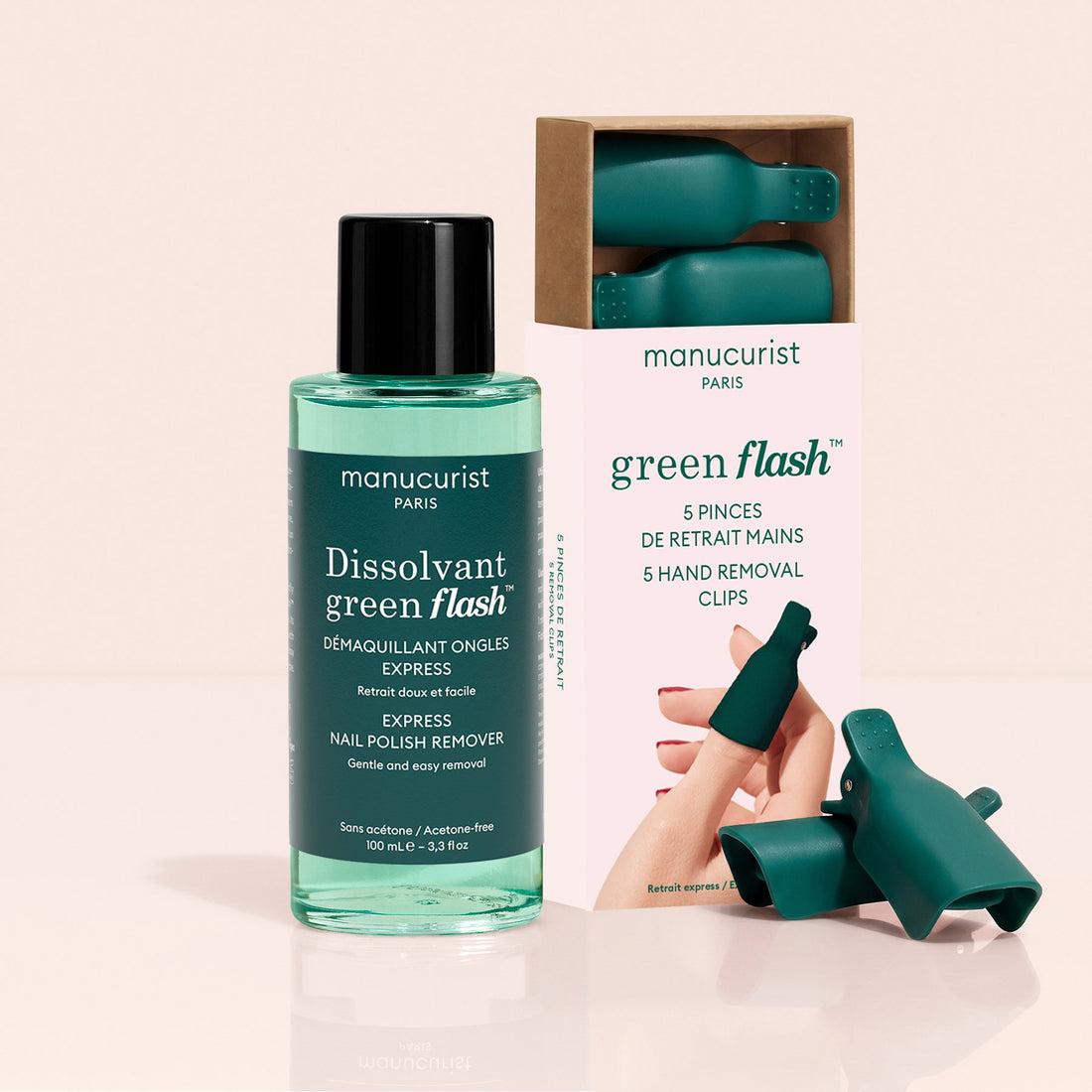 A bottle of Manucurist Nail Clips  Green Flash™ Remover Duo sits beside its box, with two green hand removal clips displayed in front.