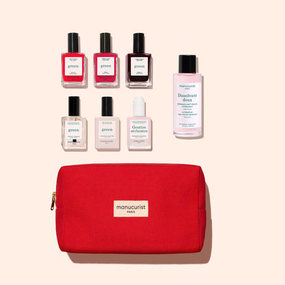 A Manucurist Starter Kit, featuring a red manicure bag with six gel-effect nail polish bottles and one nail polish remover displayed above it, all set against a light beige background.