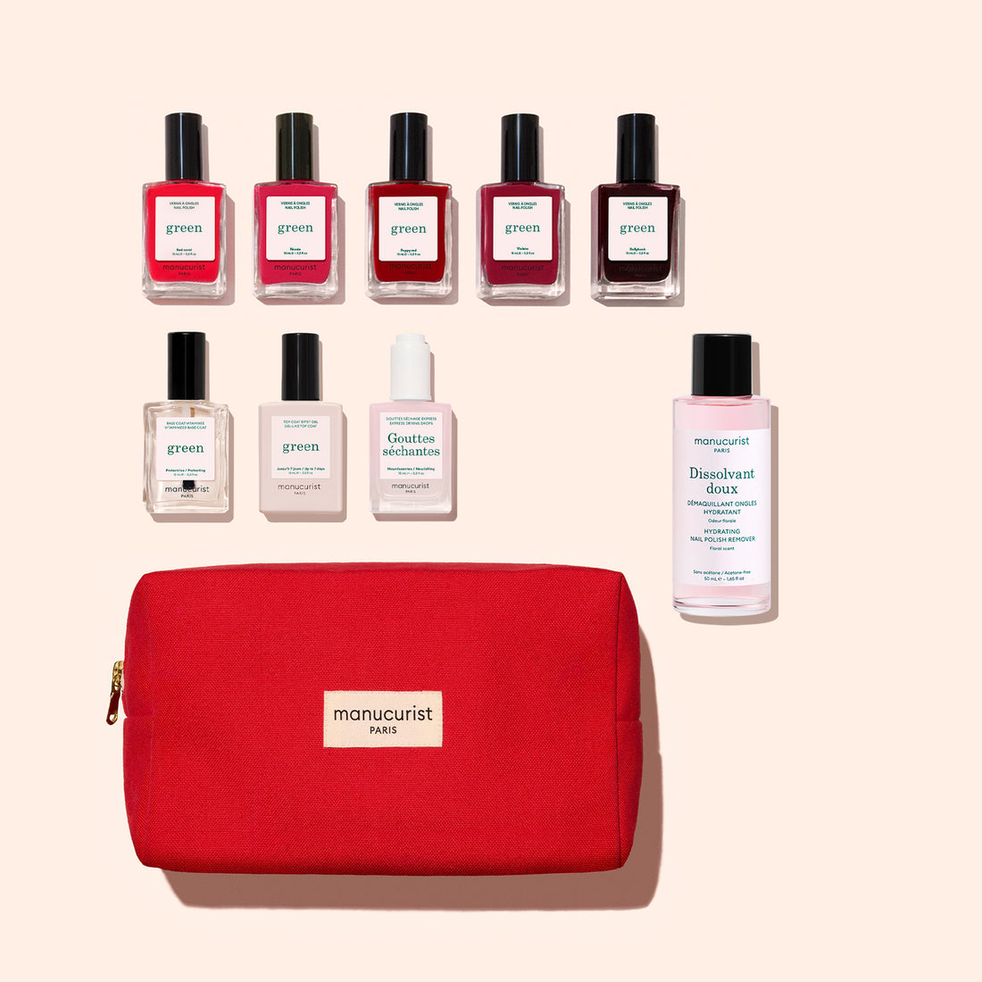 The Manucurist Super Starter Kit features a sleek red pouch, eight bottles of plant-based nail polish in assorted shades, a gentle nail polish remover, and nourishing nail care drops—all arranged on a bright surface for the perfect Green manicure set.