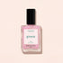 Manucurist’s Green glazed nail polish in the light pink shade “Halo,” shown with a black cap against a pale pink background.