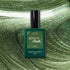 A bottle of Manucurist Groove Green Flash gel in a pearly green shade is displayed against a swirling, sparkling green background that perfectly matches the color of the Groove Green Flash gel.