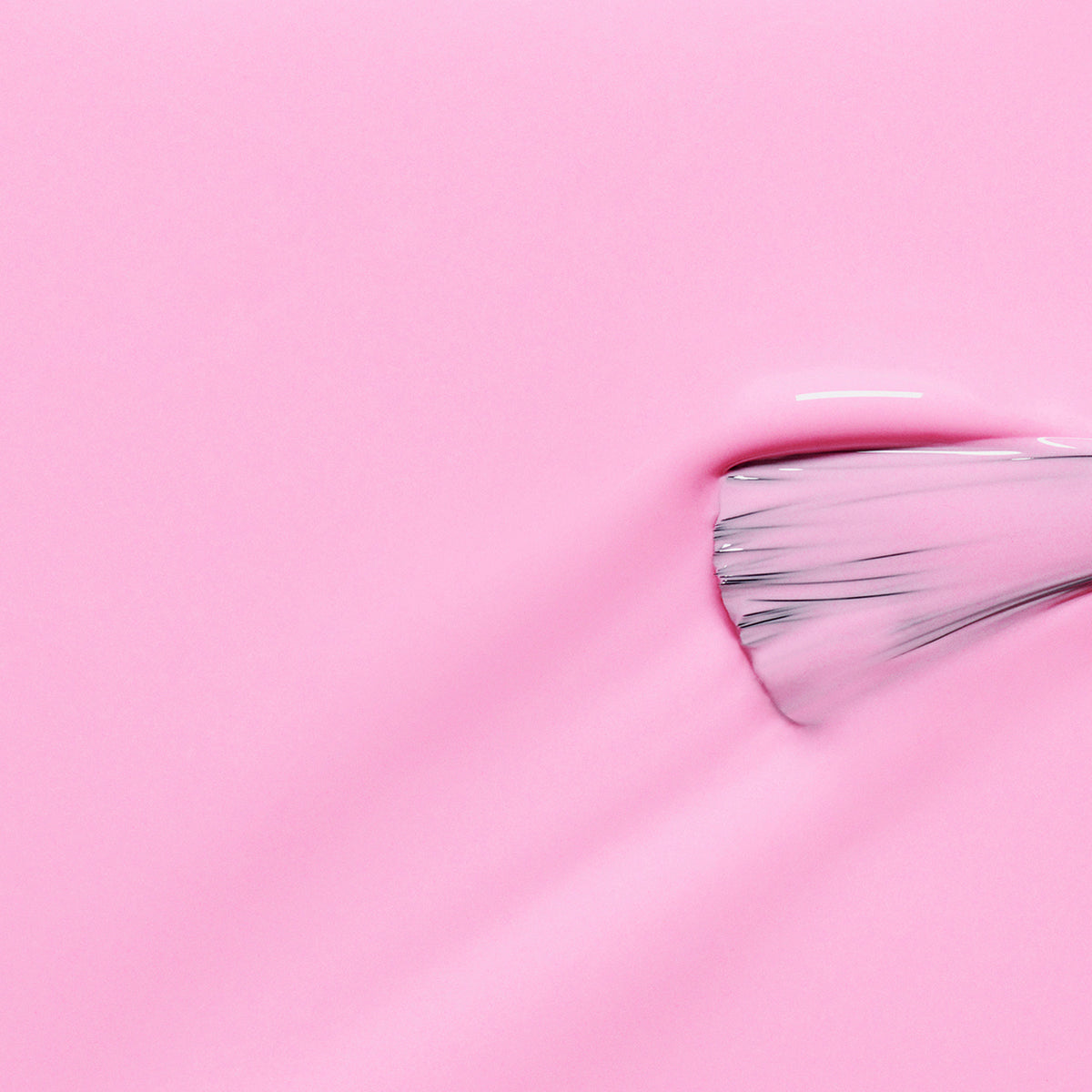A close-up of a brush applying Manucurist-test&