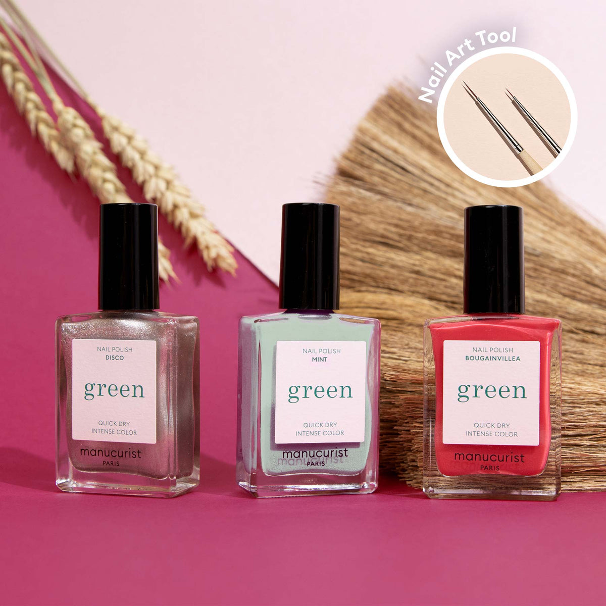 Three bottles from the Manucurist Summer Love collection—pink, mint green, and Coral Reef—sit on a pink surface with dried grasses. A circular inset shows a dual-ended Nail Art Brush, ideal for creating Coral Reef nail art.