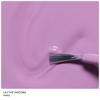 A close-up of a brush applying shiny purple nail polish on a smooth surface. The glossy finish and visible brush bristles highlight the Petite Manucurist Trio by Manucurist—a children’s nail polish made from natural origin ingredients, making it an ideal holiday gift.