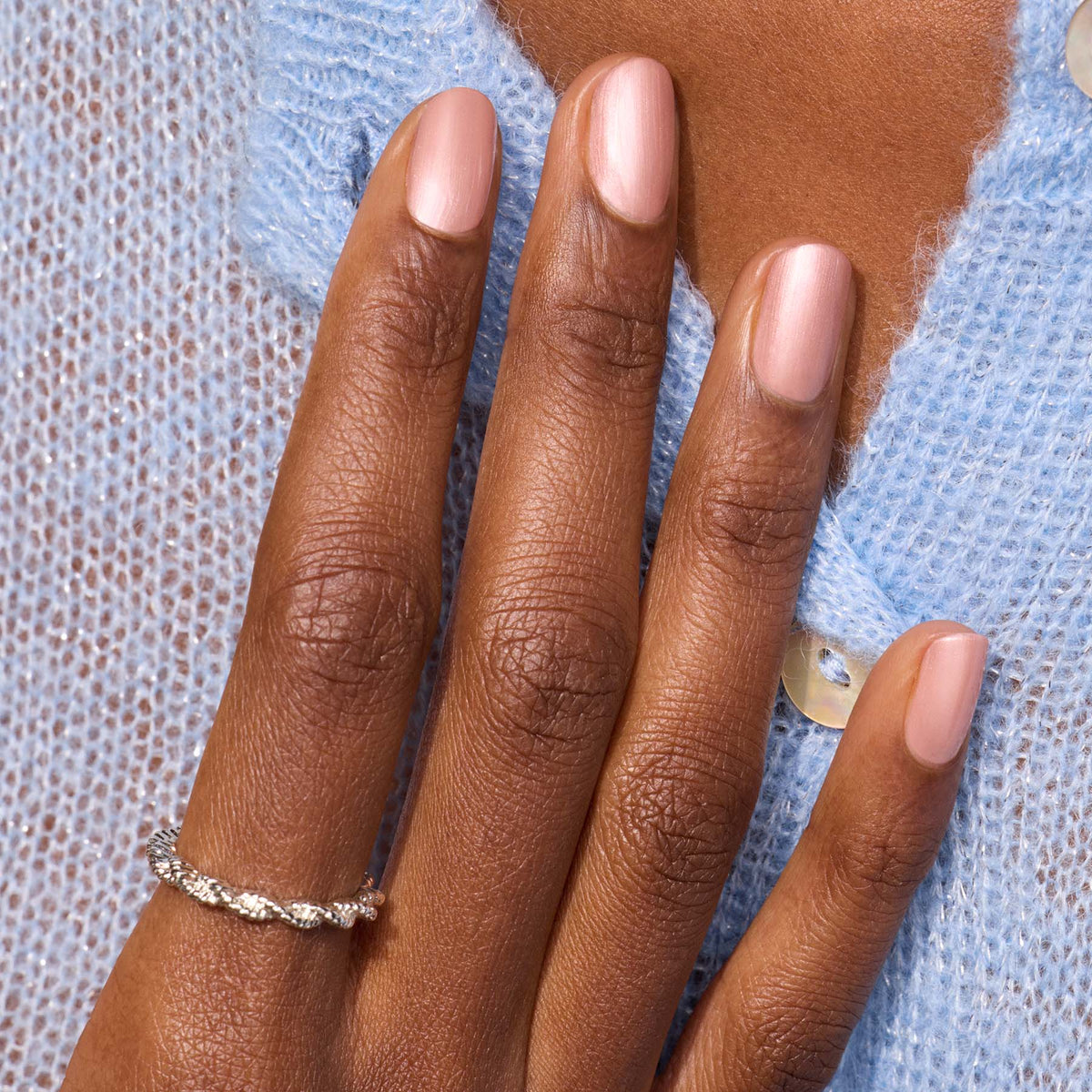 A close-up of a hand wearing Manucurist&