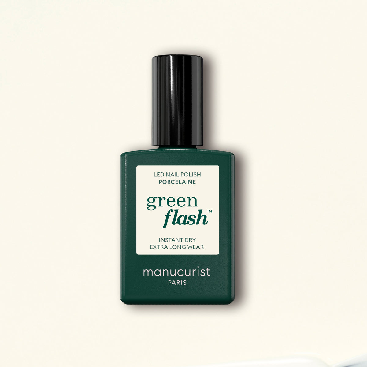 A bottle of Manucurist Porcelaine Green Flash LED gel polish with a black cap is shown against a light beige background.