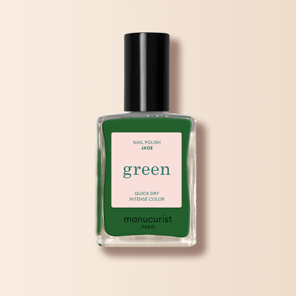 Manucurist Jade is a mineral green nail polish with cool undertones, presented in a glass bottle with a black cap and cream label featuring green and pink text.
