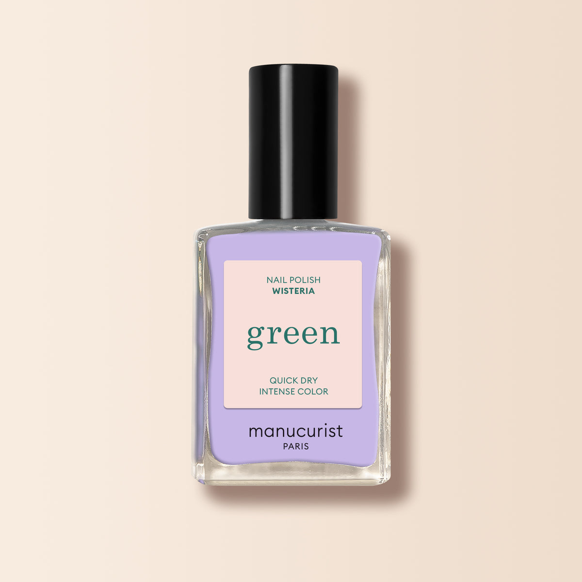 Manucurist Wisteria is a pastel purple nail polish with cool blue undertones. It comes in a black-capped bottle, featuring a minimalist label with green and peach accents on a light beige background.