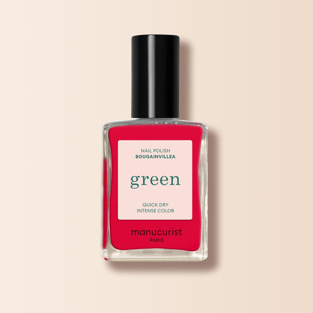 A bottle of Manucurist Bougainvillea nail polish with a black cap, featuring the label: Nail Polish Bougainvillea, green, Quick Dry Intense Color. The background is a light beige gradient.