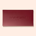 A closed rectangular Burgundy Holiday Rainbow Box by Manucurist, featuring the brand name embossed on the lid, set against a light beige background.