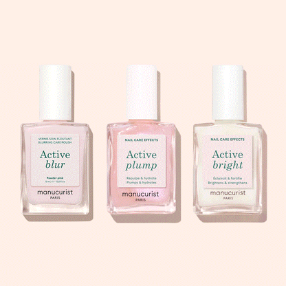 Three bottles of Manucurist Customisable Trio Active™ nail care polishes—Active Blur, Active Plump, and Active Bright—are displayed side by side on a light pink background, each delivering a unique effect for personalised nails.