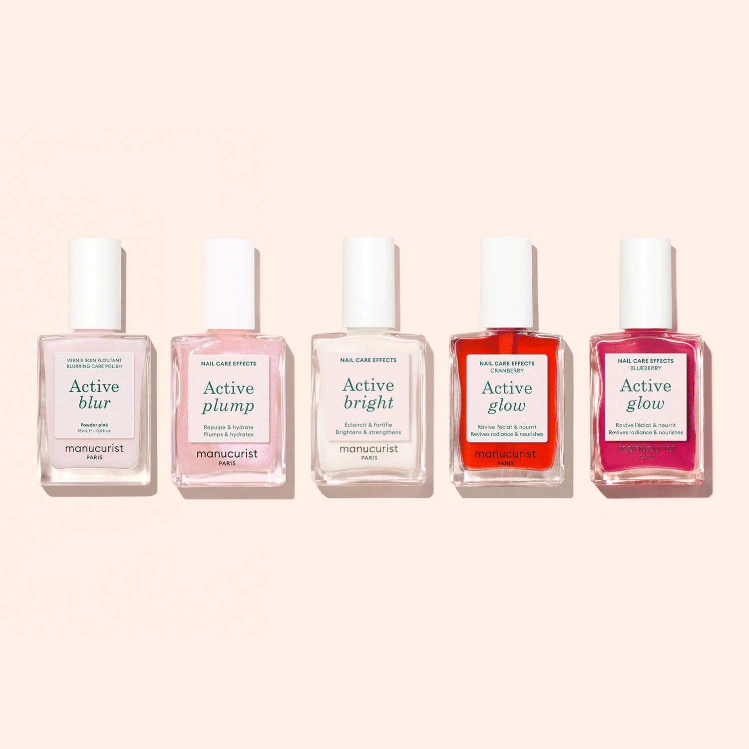 Five Manucurist Customisable Rainbow Active™ nail polishes are arranged against a light beige background, each offering unique effects—Blur, Plump, Bright, and two Glow—for a personalized manicure.