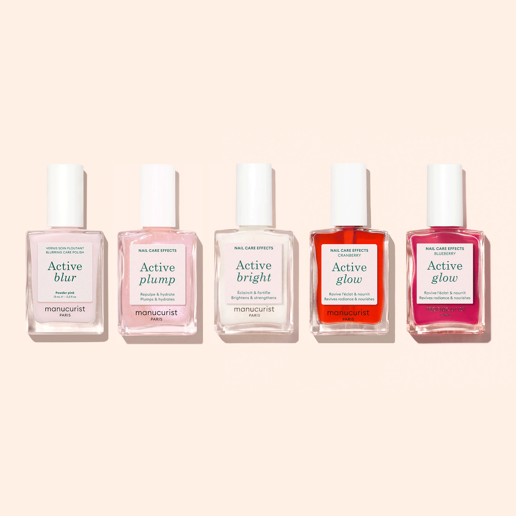 Five Manucurist Customisable Rainbow Active™ nail polishes are arranged against a light beige background, each offering unique effects—Blur, Plump, Bright, and two Glow—for a personalized manicure.