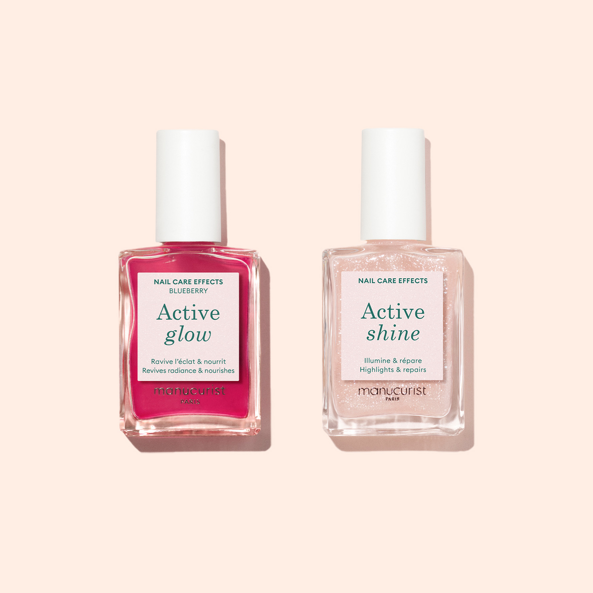 Two bottles from Manucurist’s Active™ Duo rest on a pale peach background. The set features formulas to brighten and repair, leaving your nails nourished and glowing.