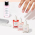 A manicured hand is displayed alongside the Manucurist Active™ Manicure Kit, featuring nail polish remover, three nail polishes, and nail files—all neatly arranged on a white surface. These essentials from Manucurist provide the perfect start to your flawless manicure routine.
