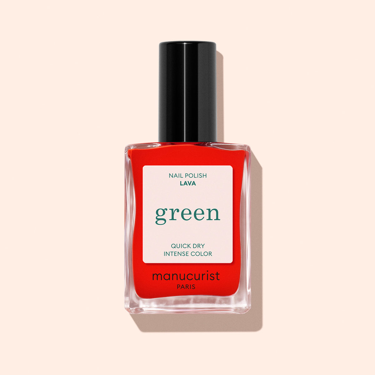 Lava by Manucurist is a vibrant red nail polish with orange undertones and a black cap, showcased against a pale peach background—making it the perfect summer shade.