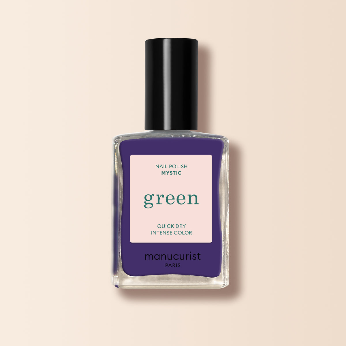 Manucurist Mystic is an opaque violet nail polish in a dark purple shade, presented in a rectangular bottle with a black cap, shown against a light beige background.