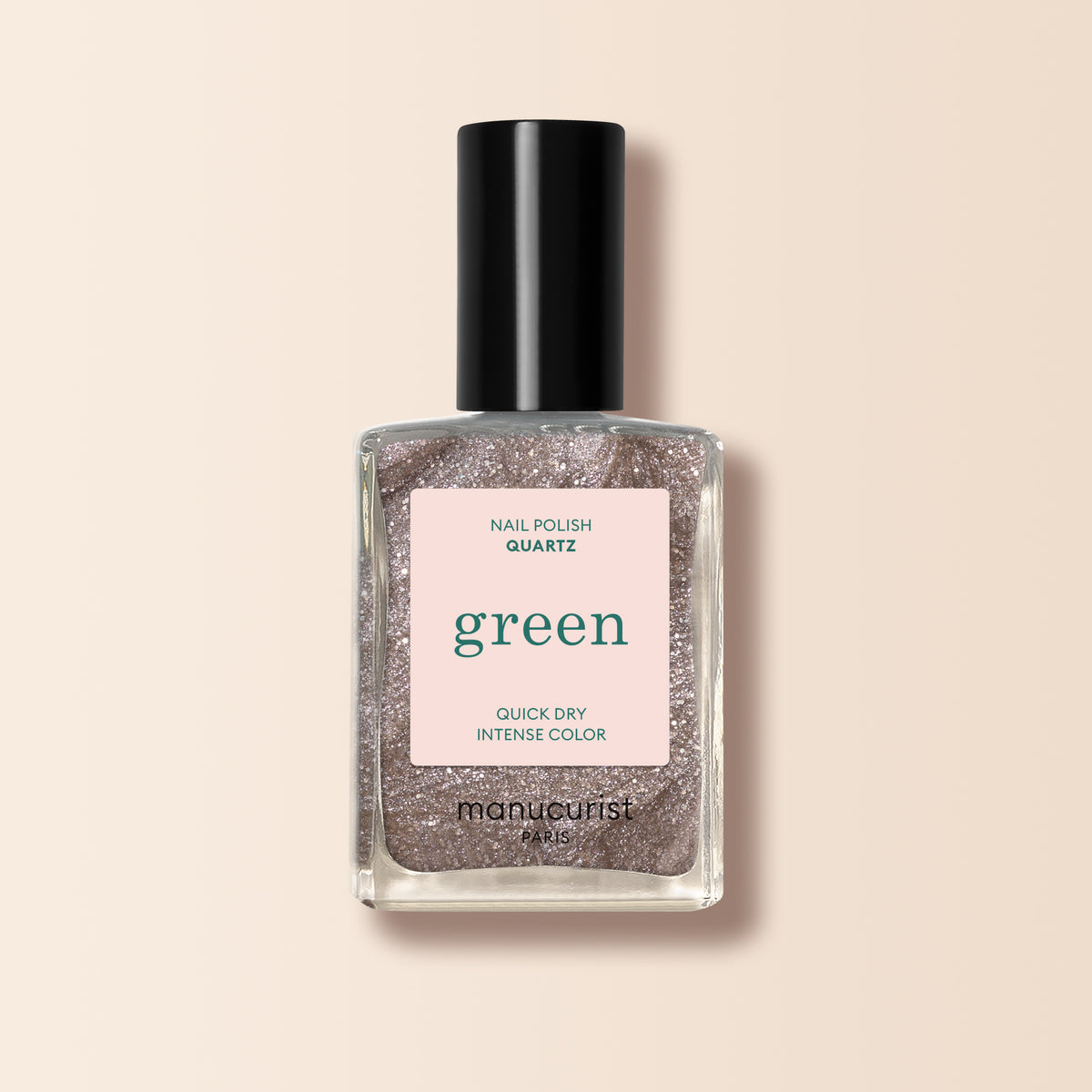 A bottle of Manucurist Quartz nail polish with a black cap and pink label. Quartz is a sparkly brown shade with taupe hints, delivering an intense, glittery finish for eye-catching nails.