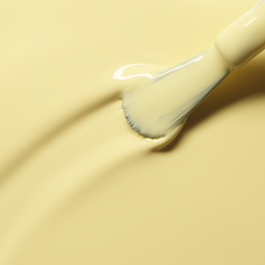 A close-up of a brush applying Manucurist&