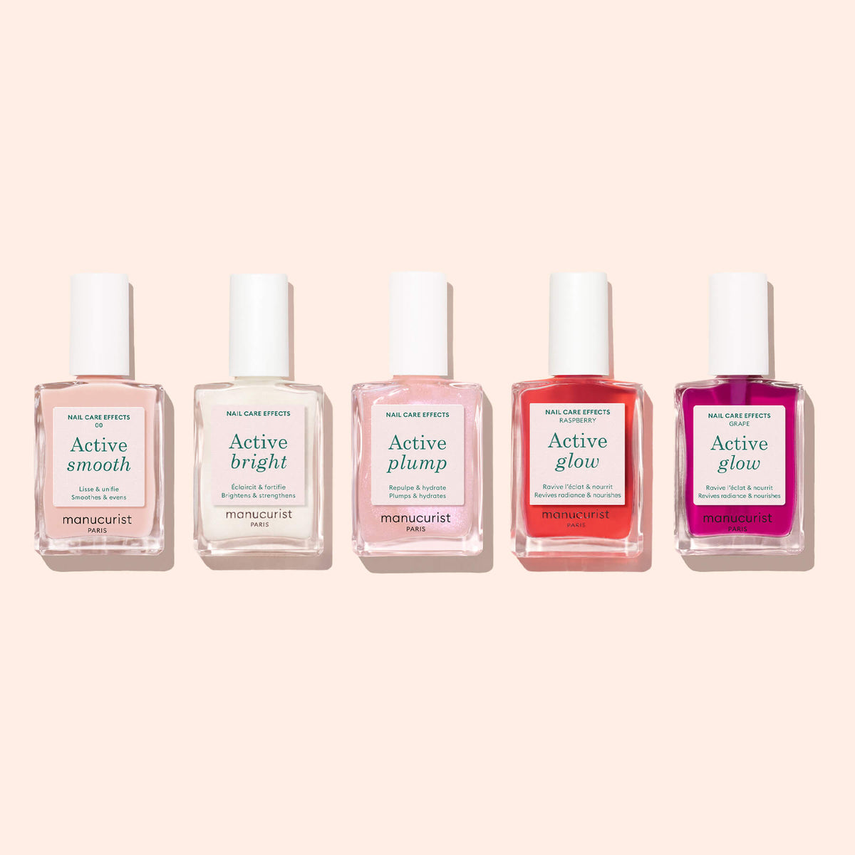 Five bottles of Manucurist nail treatments arranged in a row on a pale pink background, featuring Active™ Smooth 00 alongside Active Bright, Active Plump, and two bottles of Active Glow—the ideal collection for anyone looking for expert nail care or the ultimate CC Polish Treatment from Manucurist to achieve flawless nails.