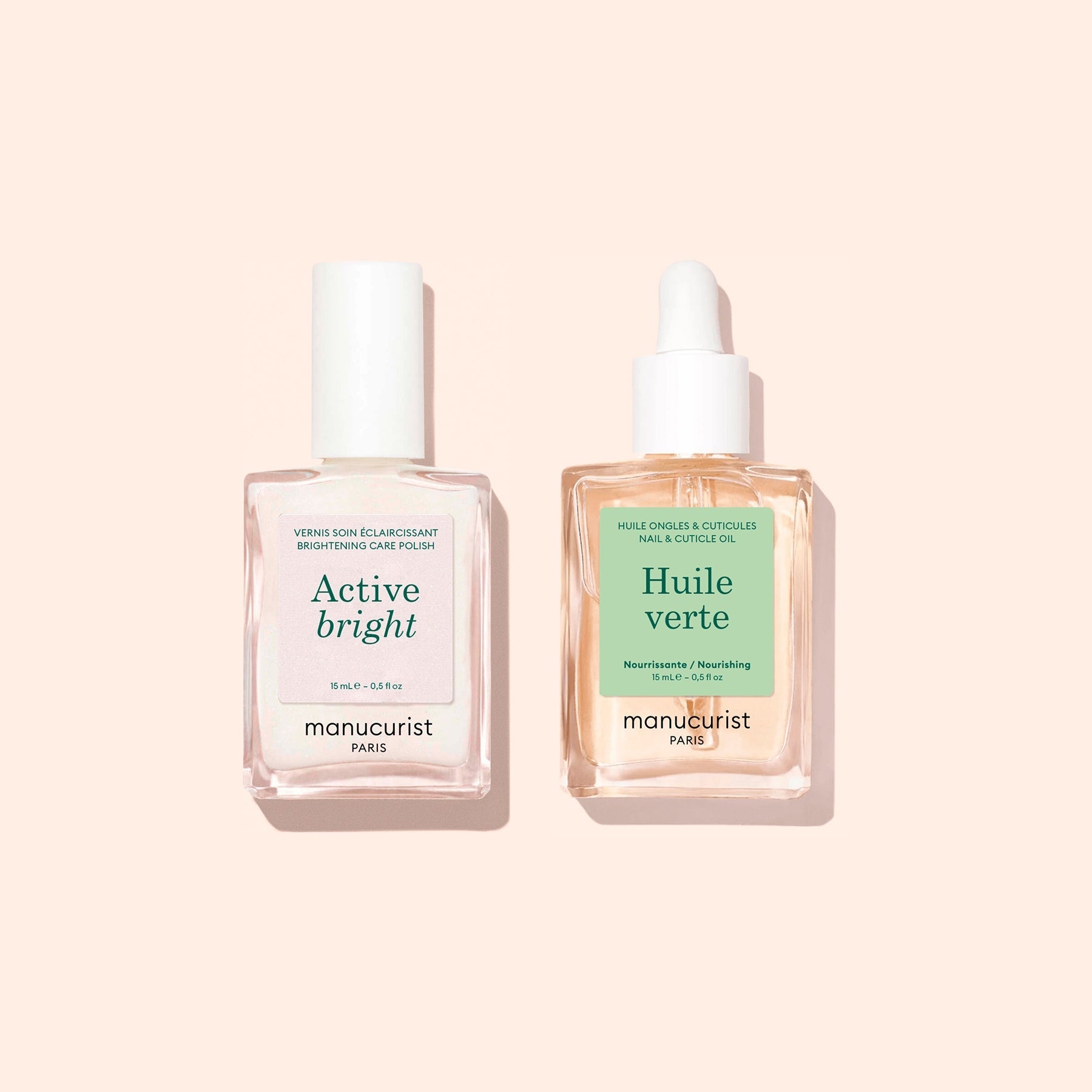 Two clear manicure bottles from Manucurist’s "Basic Routine - Yellow Nails" on a pale background: one labeled Active Bright with a white cap, expertly formulated for nail brightening, and the other, Huile Verte with a dropper, ideal as nourishing cuticle oil. Both products offer essential nail care solutions from Manucurist.
