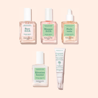 Five manicure essentials from Manucurist’s Basic Routine - Damaged Nails set—base, mask, oil, booster, and concentrate—are arranged neatly on a light pink background. Each product is housed in a clear or white bottle with fresh green and pink labels, making them perfect for repairing damaged nails and strengthening brittle tips while elevating your nail care routine.