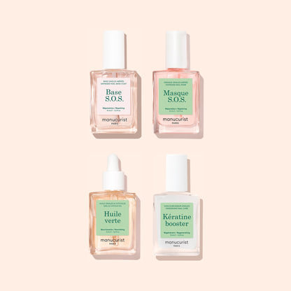 A set of four square bottles from Manucurist’s Basic Routine - Damaged Nails collection, displayed on a light pink background and labeled Base S.O.S., Masque S.O.S., Huile Verte, and Kératine Booster—each expertly formulated to strengthen brittle nails and repair damage for healthier-looking hands.