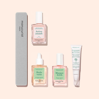 Five essential products from Manucurist’s Starter Routine - Ridged Nails set are arranged on a light pink background, including a nail file, two dropper bottles, a spray bottle, and a small tube—all adorned with pastel green and pink labels. Ideal for comprehensive nail care, this set provides everything you need to pamper ridged nails or gently smooth out imperfections using the included nail buffer.