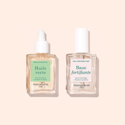 Two clear glass bottles of Manucurist&