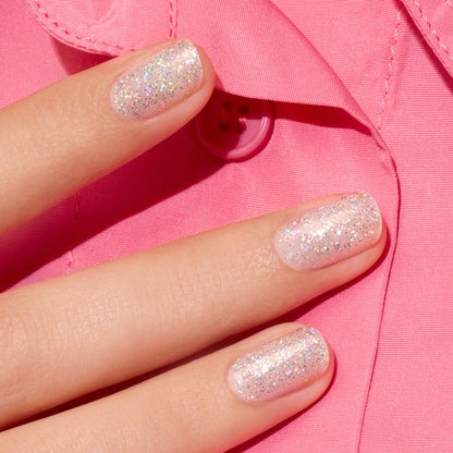A close-up of a hand with short nails painted in Manucurist&
