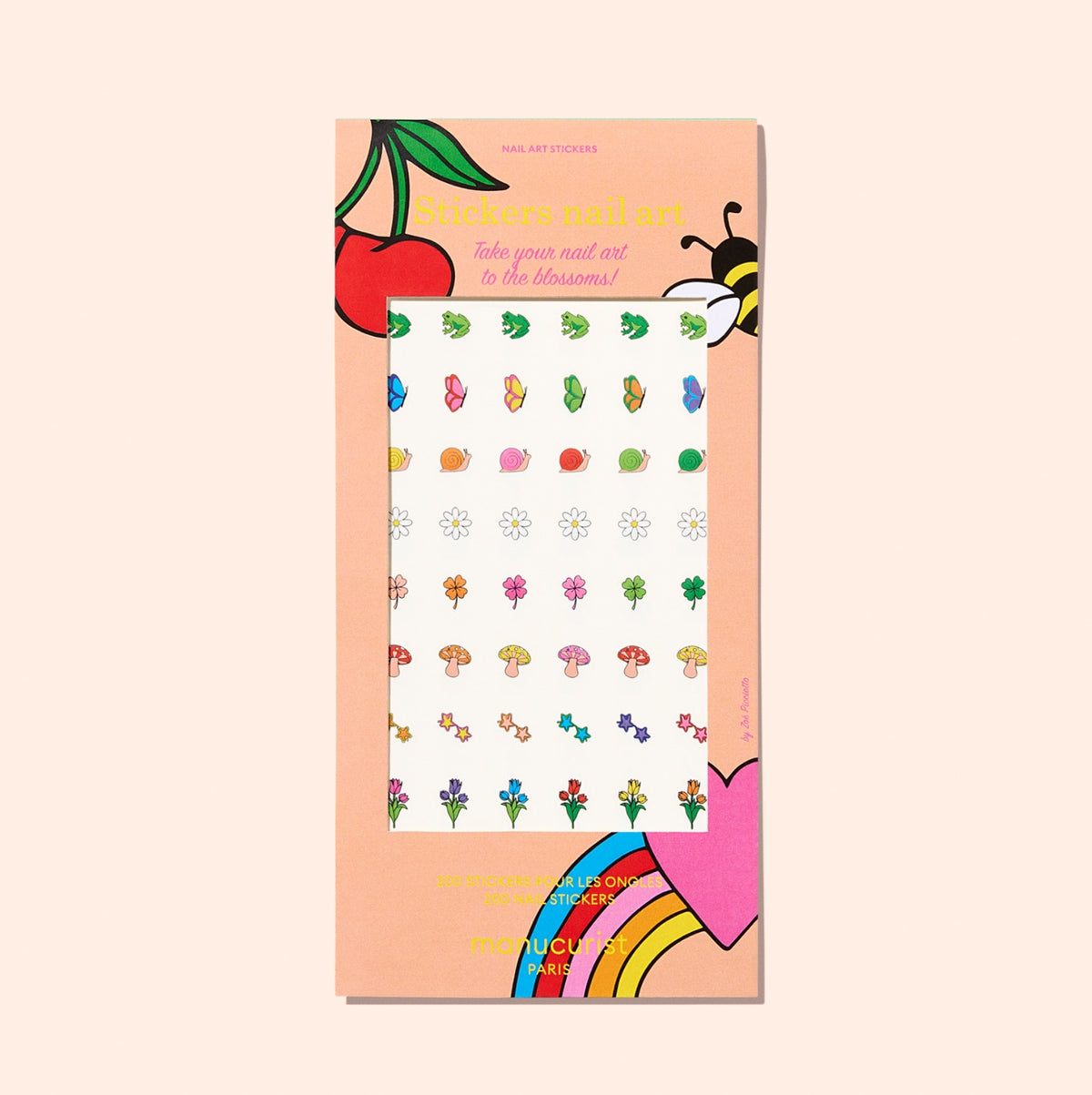 Manucurist Nail Art Stickers come in a peach package decorated with playful flowers, cherries, and hearts, featuring colorful nature-inspired designs—perfect for fresh summer nails.