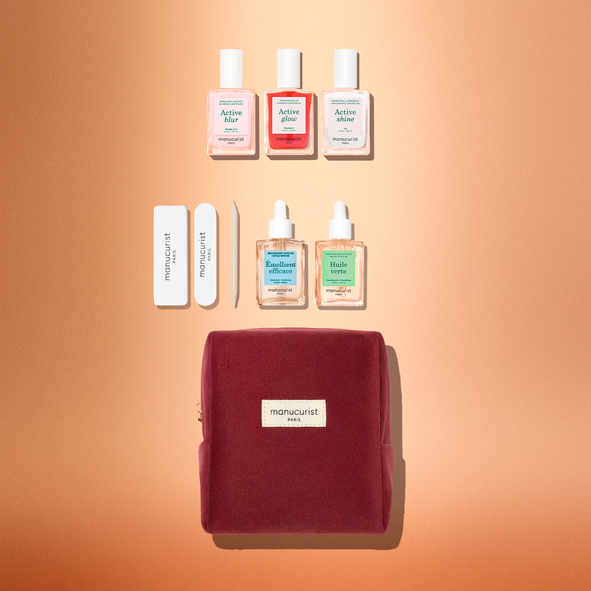 Manucurist Active™ Starter Kit Gift Set including three nail polishes, two nail and cuticle oils, two nail files, a cuticle pusher, and a zippered velvet pouch.