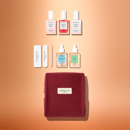 Manucurist Active™ Starter Kit Gift Set including three nail polishes, two nail and cuticle oils, two nail files, a cuticle pusher, and a zippered velvet pouch.