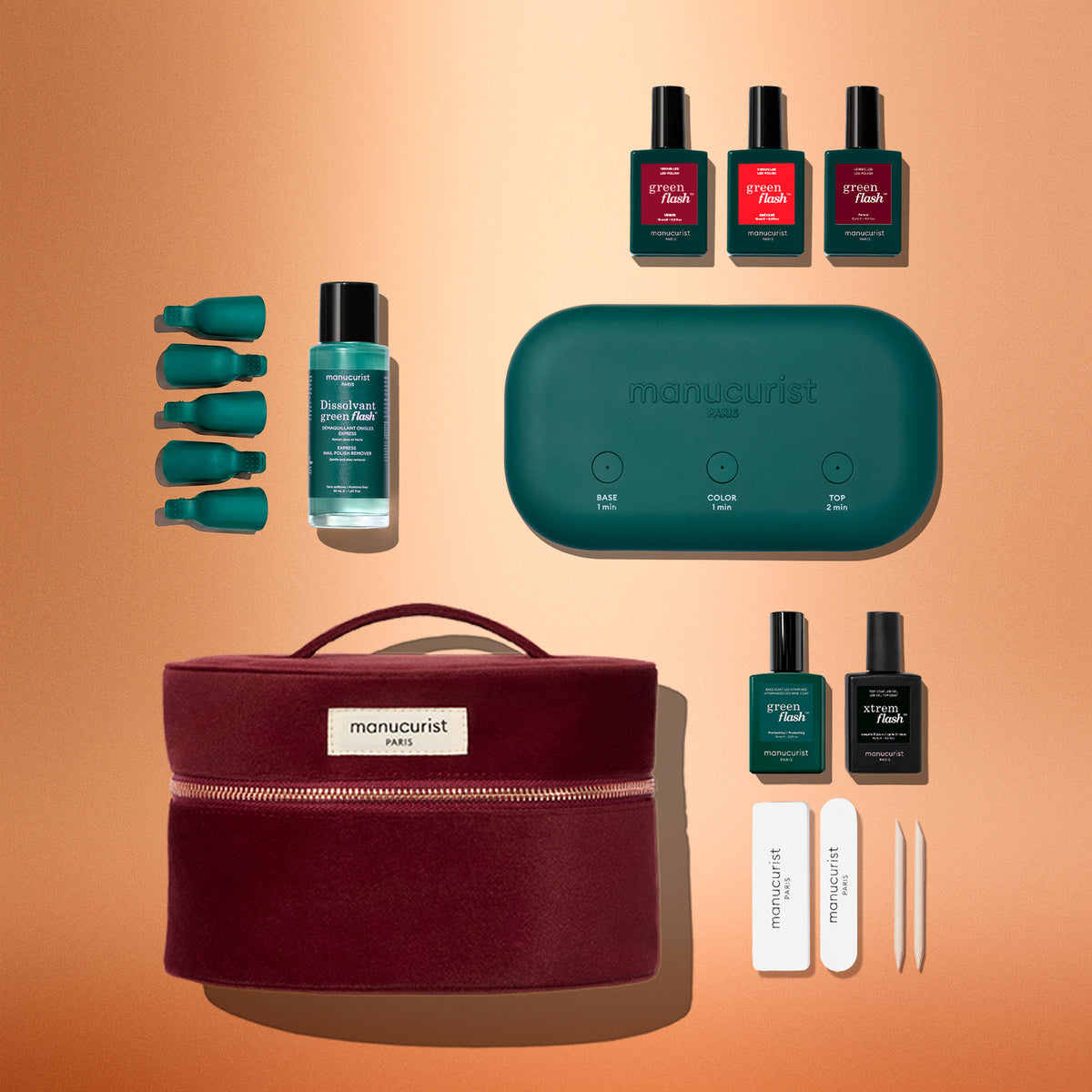 The Green Flash™ Starter Kit Gift Set by Manucurist includes a portable lamp, bottles of polish and remover, nail files, and a burgundy zippered carrying case for a salon-style manicure at home.