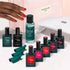 A hand with red nails reaches towards the Manucurist Super Starter Kit, featuring Green Flash gel polish, remover, finger caps, a vitaminized base coat, a nail lamp, and a pink bag labeled manucurist PARIS—perfect for achieving 21 days’ wear.