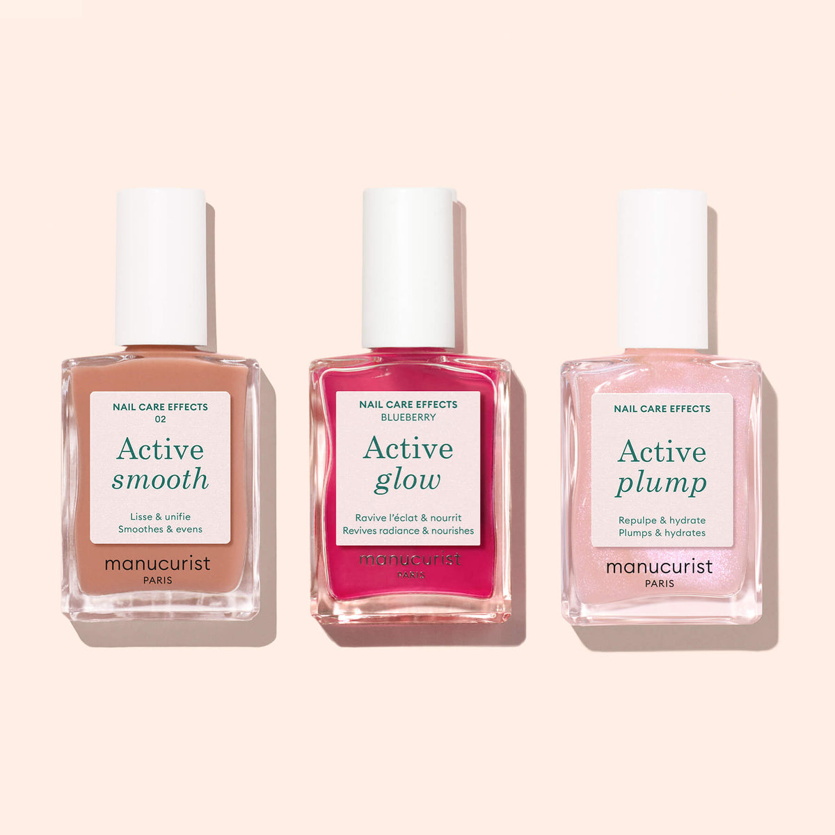 Three bottles of Manucurist’s Active™ nail care polishes—Active™ Smooth 02, Active™ Glow, and Active™ Plump—are displayed on a light beige background, showcasing the perfecting treatment that elevates your nail care routine.