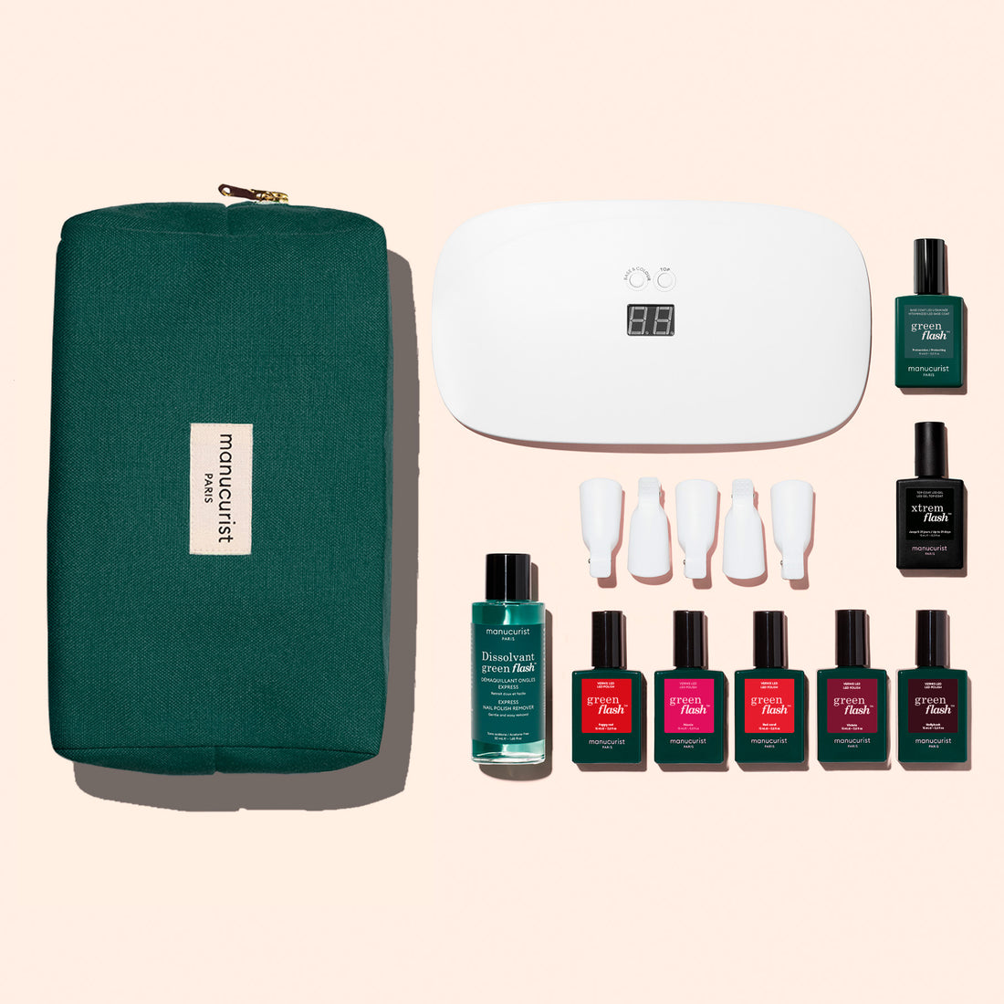 The Manucurist Super Starter Kit features a green zippered pouch, white LED nail lamp, remover, four Green Flash gel polishes, two Vitaminized Base/Top Coats, and four nail tools—everything you need for an ultra-glossy manicure.