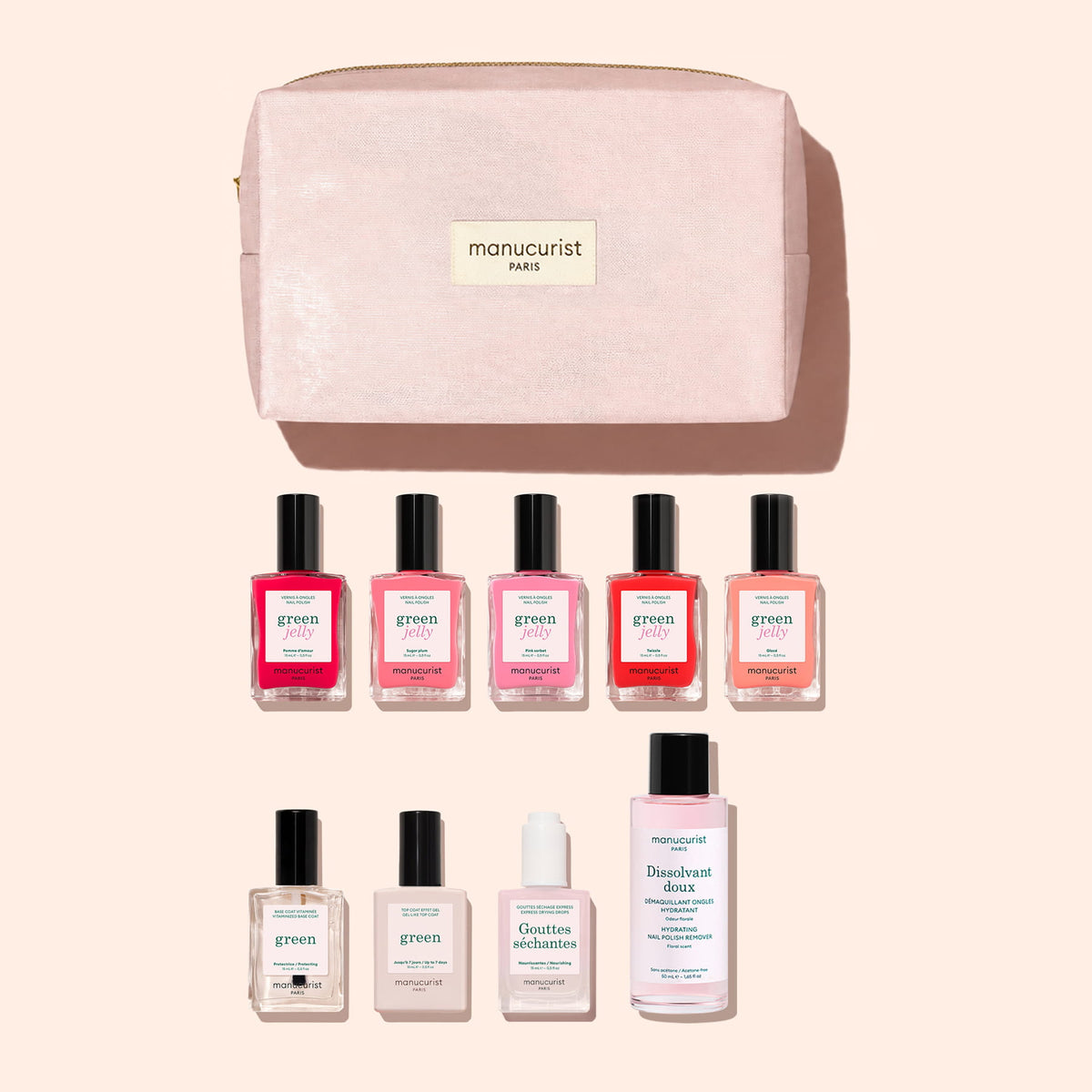 The Manucurist Super Starter Kit - Jelly Nail Polish features a pink organic cotton pouch that doubles as a stylish manicure bag, neatly organizing eight essential nail care products—including five vibrant Green gel-effect polishes, a clear Green polish, hydrating drops, and gentle nail polish remover—displayed against a pale background.