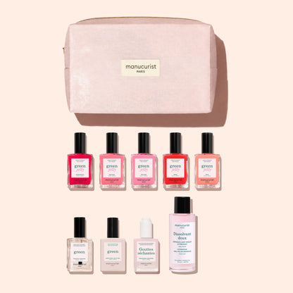 The Manucurist Super Starter Kit - Jelly Nail Polish features a pink organic cotton pouch that doubles as a stylish manicure bag, neatly organizing eight essential nail care products—including five vibrant Green gel-effect polishes, a clear Green polish, hydrating drops, and gentle nail polish remover—displayed against a pale background.