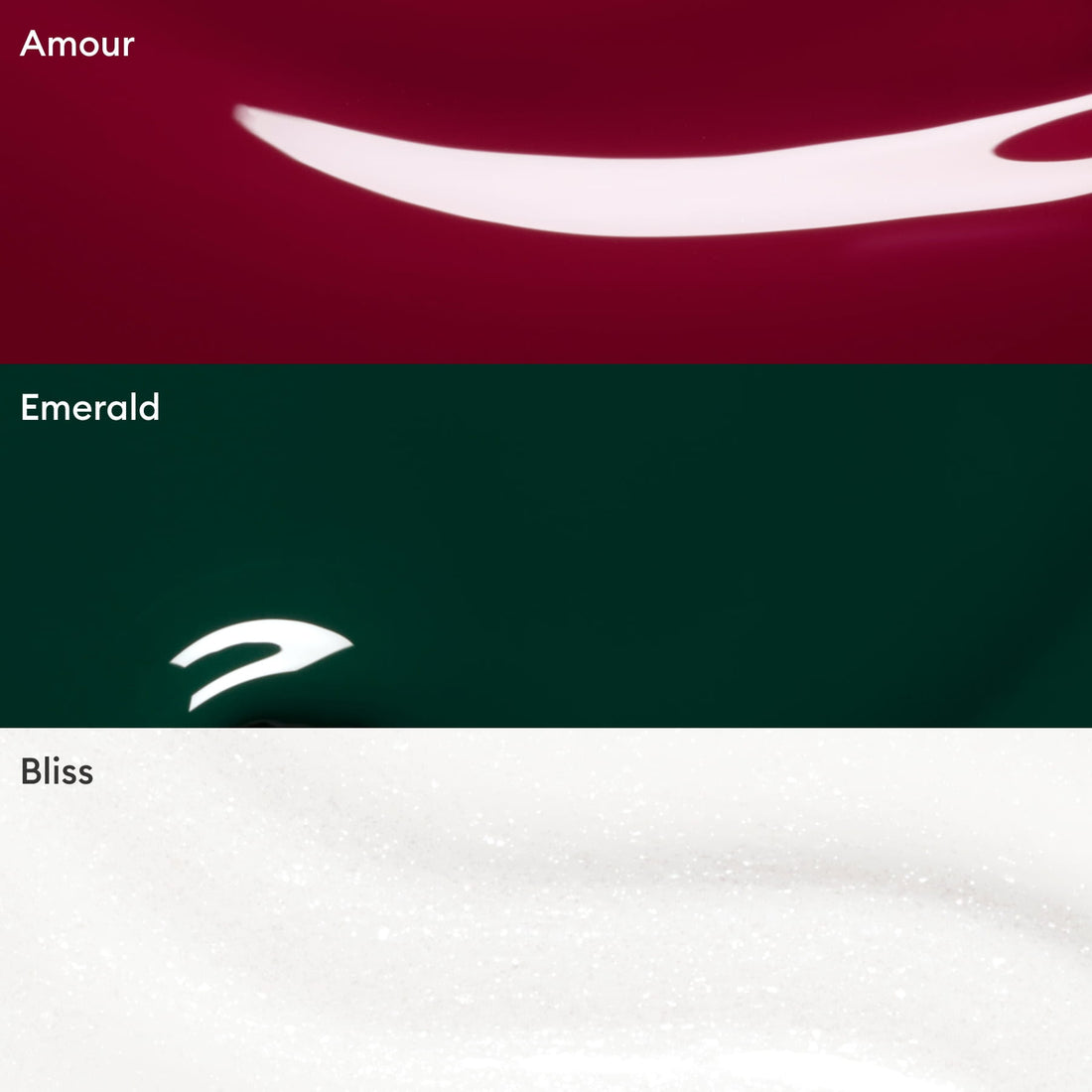 Three color swatches from Manucurist’s Customisable Trio Green—Amour (deep red), Emerald (dark green), and Bliss (white with shimmer)—each feature a smooth, glossy texture with a reflective curved highlight, perfect for creating your personalized nail polish trio or discovering on-trend green shades.
