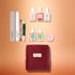 The Manucurist Active™ Ultimate Kit Gift Set features three nail polishes, two dropper bottles, a round balm tin, two nail files, a cuticle pusher, and a correction pen arranged above a velvet cosmetic bag.
