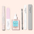 The Manucurist Glossy Booster Duo includes a nail exfoliator pen, two nail files, a cuticle softener with dropper, a cuticle pusher, and a glossy nail file, all arranged on a light background.