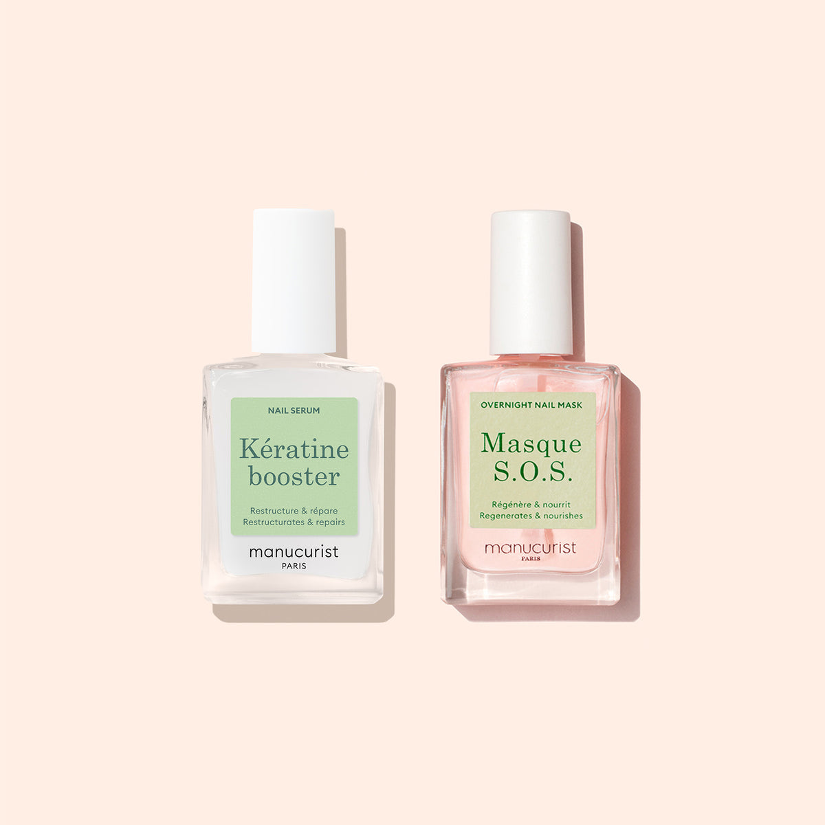 Two glass bottles of Manucurist nail care products sit on a light beige background. The left is Nail Strengthening Serum, a powerful fortifier, and the right restores damaged nails. Both have white caps with minimalist green and pink labels.